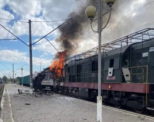 A passenger train is engulfed in flames following Russia