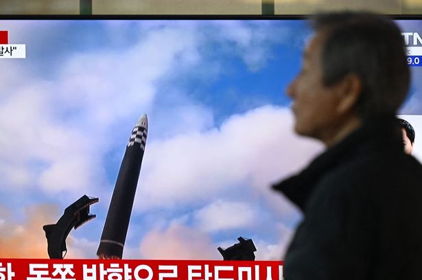 Live footage on a television screen of missile tests in North Korea