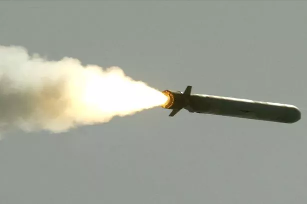 A Tomahawk cruise missile flies toward Iraq after being launched from the AEGIS guided missile cruiser USS San Jacinto March 25, 2003 in the Red Sea