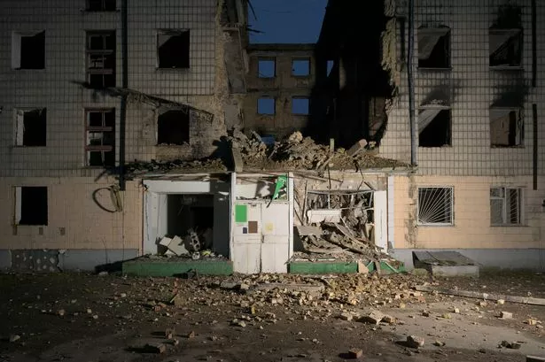Damaged residential building after airstrikes in Borodyanke, Ukraine at night