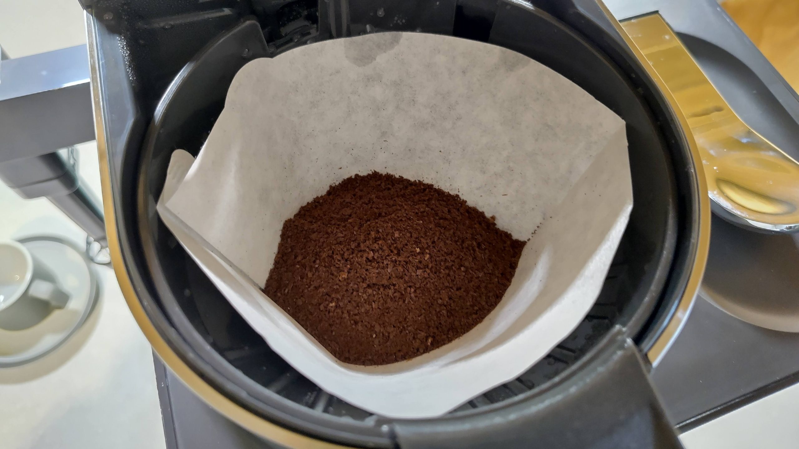 Ground coffee in Ninja Prestige Dual-Brew System filter basket