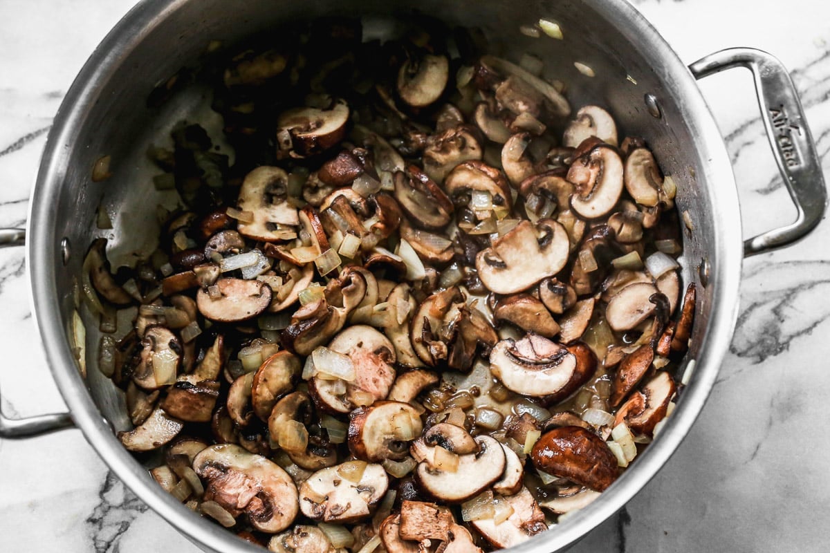 mushrooms and onions in a pot