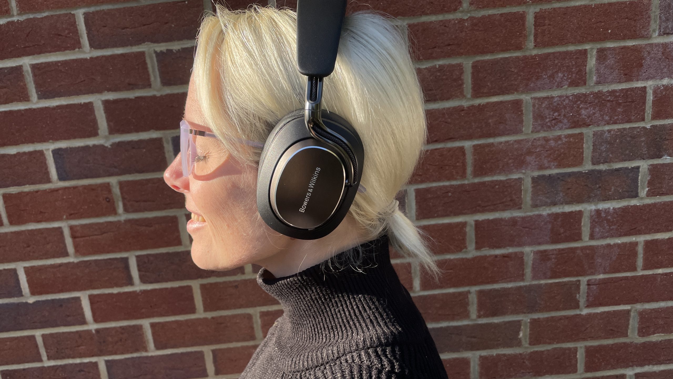 Bowers & Wilkins Px8 S2 in front of a red brick wall
