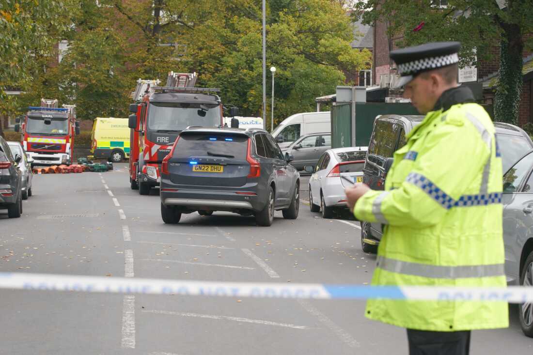 Police guard a cordon at the scene of a stabbing incident at Heaton Park Hebrew Congregation synagogue, in Crumpsall, Manchester, England.
