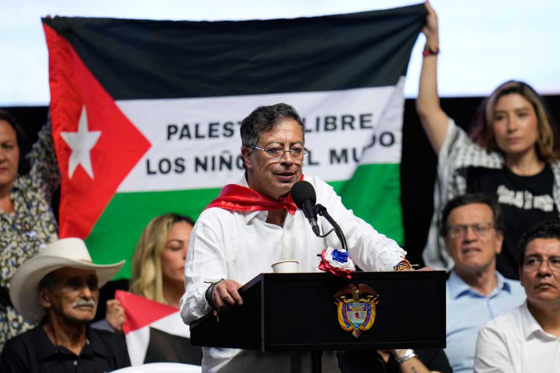 Supporters of Colombian President Gustavo Petro display a Palestinian flag as he addresses a rally in Ibague, Colombia, Oct. 3, 2025.