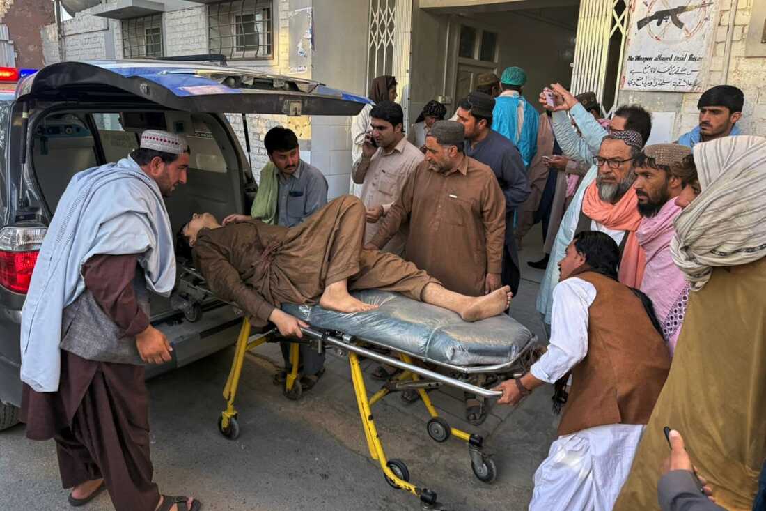 People bring a man who was injured in the clashes between Pakistan and Afghan forces in the border area for medical treatment at a hospital in Chaman, Pakistan, Wednesday.