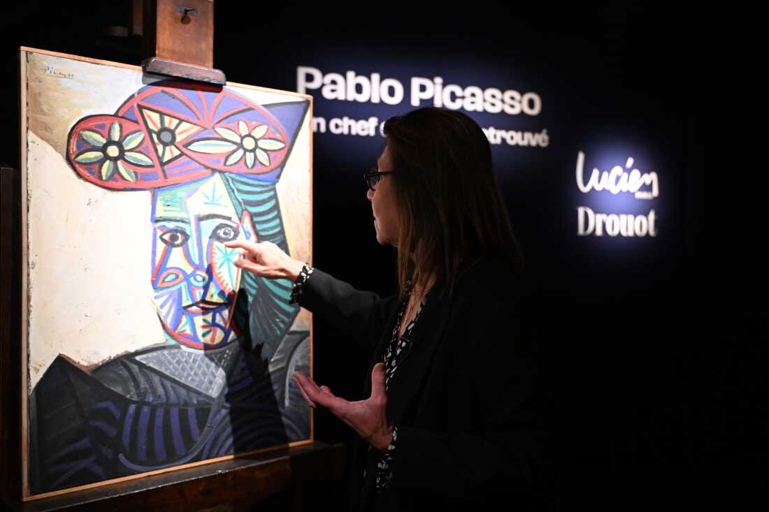 Art expert Agnes Sevestre-Barbe points to a rediscovered Picasso painting