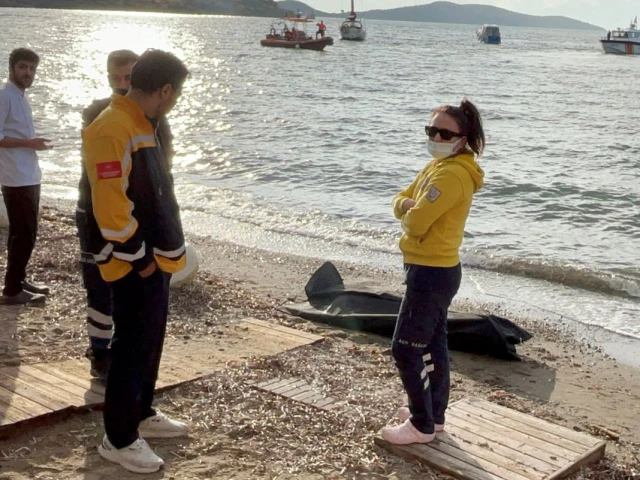 health workers stand next to a body bag as members of the coast guard command conduct a search and rescue operation after a migrant boat sank off the coast of bodrum in western mugla province turkey october 24 2025 photo reuters