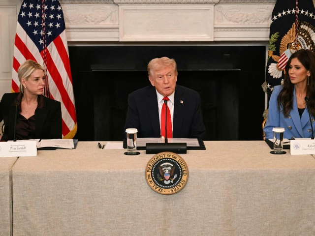 us president donald trump flanked by attorney general pam bondi l and homeland security secretary kristi noem r speaks during a roundtable about antifa in the state dining room of the white house in washington dc on october 8 2025 photo afp