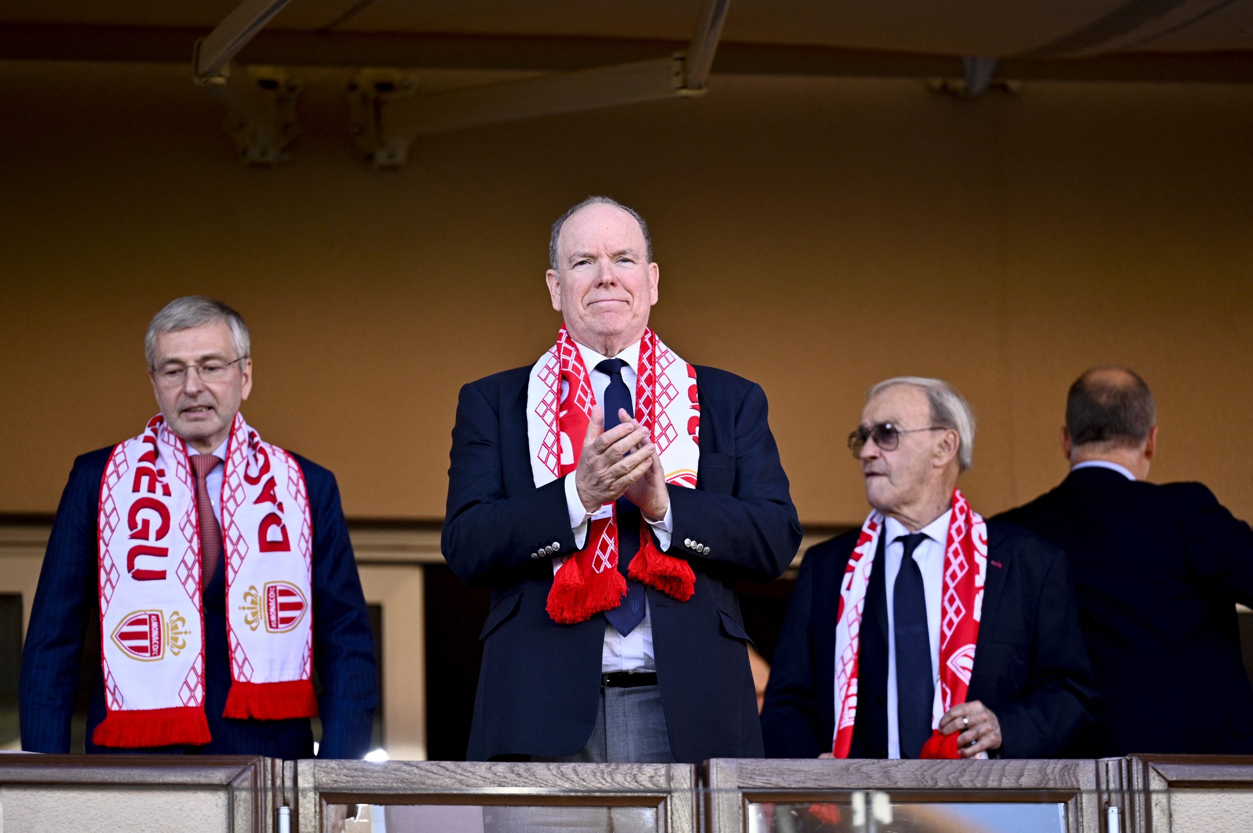 Prince Albert II of Monaco (C) and president of AS Monaco Dmitri Rybolovlev (L) attend the French L1 football match between AS Monaco and OGC Nice at the Stade Louis II in the Principality of Monaco on October 5, 2025. (Photo by Frederic DIDES / AFP) (Photo by FREDERIC DIDES/AFP via Getty Images)