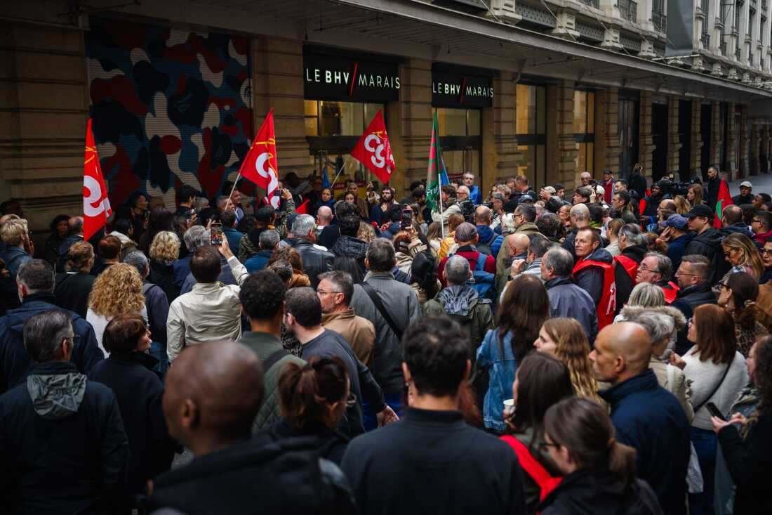 BHV department store employees take part in a demonstration in front of BHV Marais shopping center in Paris on Oct. 10, during a strike to protest against the arrival of the fast-fashion brand Shein.