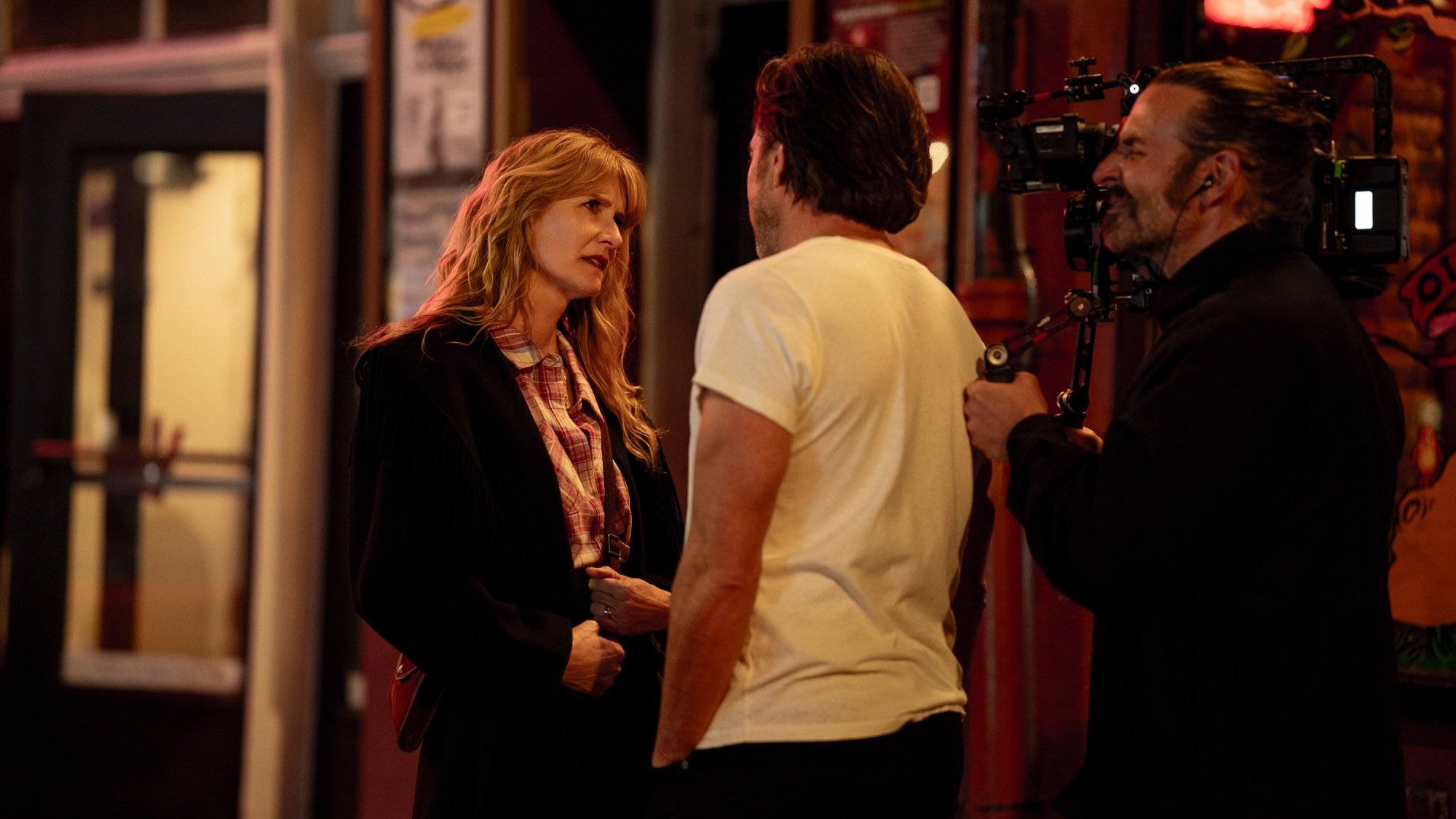 Laura Dern and Will Arnett with director Bradley Cooper on the set of