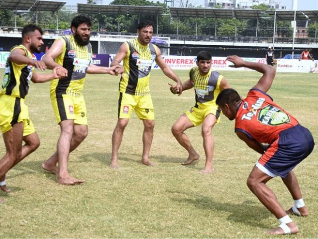 kabaddi players in action during the match between khyber pakhtunkhwa and sindh teams at punjab stadium photo app