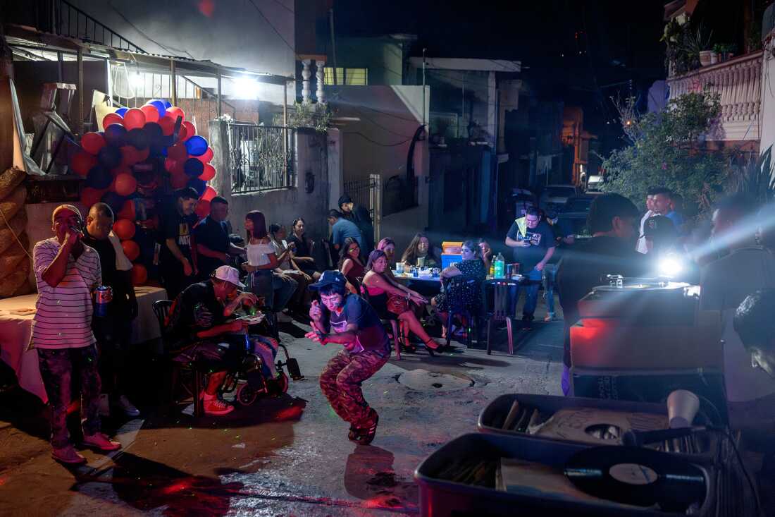 People dance at Brenda Cazárez’s 40th birthday party as Sonido Colombia plays music in the Privada Cusco neighborhood of Monterrey, Mexico, on Aug. 12, 2023.