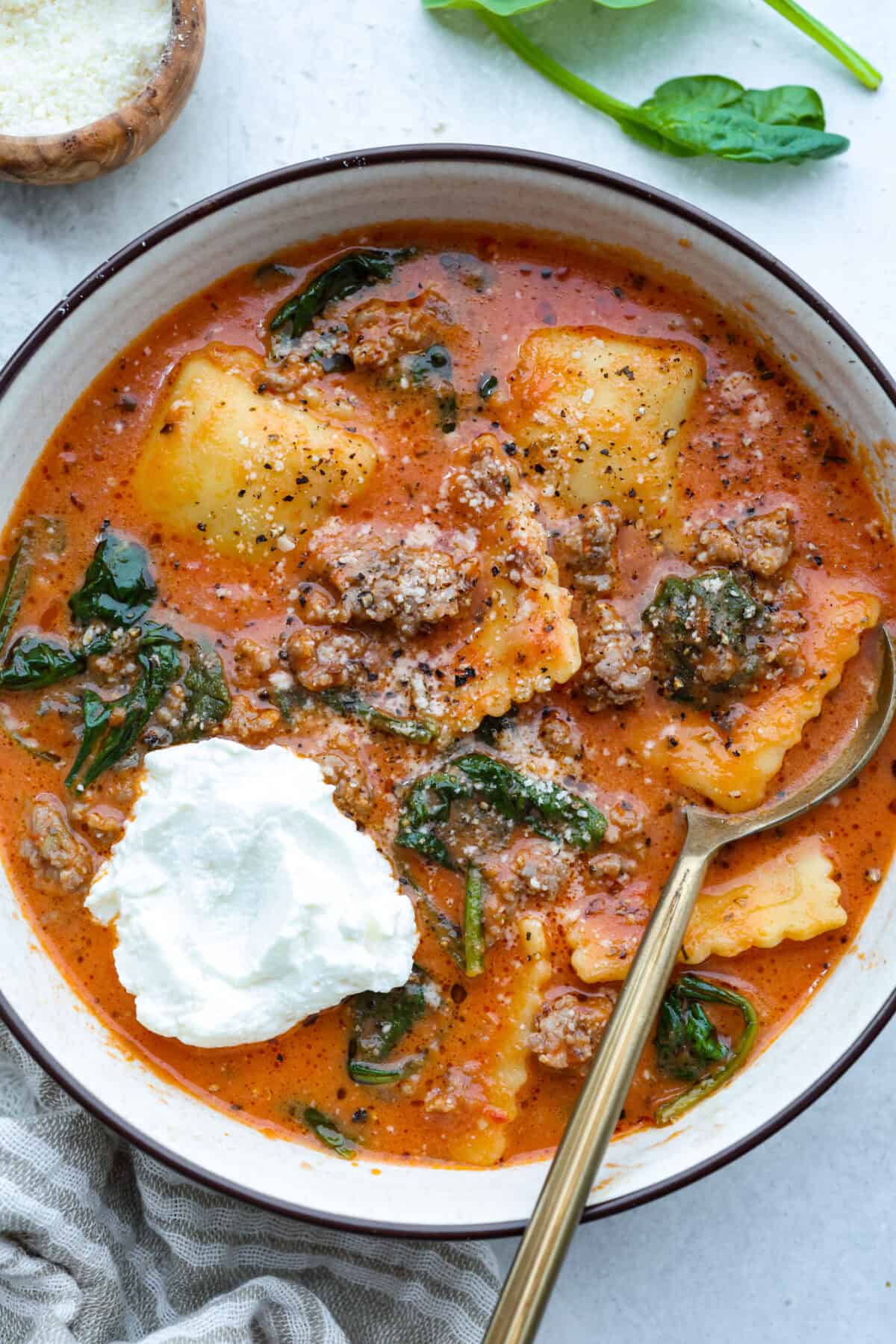 Bowl of million dollar soup with a dollop of ricotta cheese.