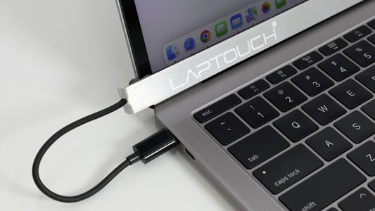 The LapTouch device that enables touchscreen capabilities on a MacBook.
