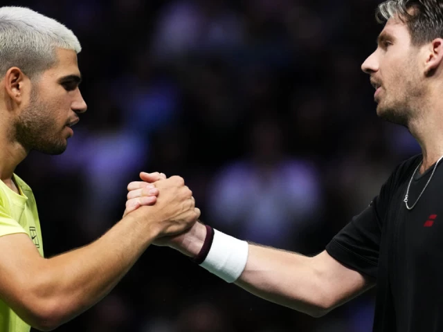 winner cameron norrie of britain r shakes hands with spain s carlos alcaraz photo afp