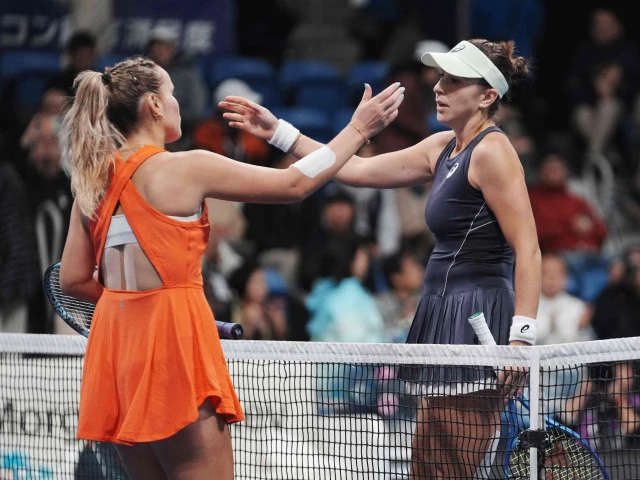 switzerland s belinda bencic r and usa s sofia kenin approach each other for a hug after their women s singles semi finals at the pan pacific open tennis tournament in tokyo on october 25 2025 photo afp