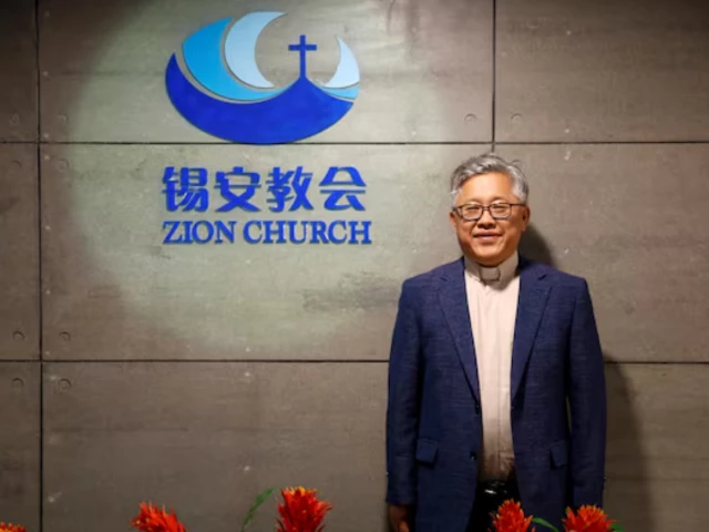 the head pastor of the zion church in beijing jin mingri poses for picures in the lobby of the unofficial protestant house church in beijing china august 28 2018 photo reuters